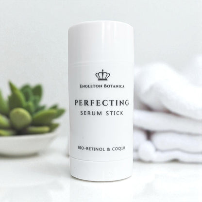 White antiaging serum stick with branding on a light background